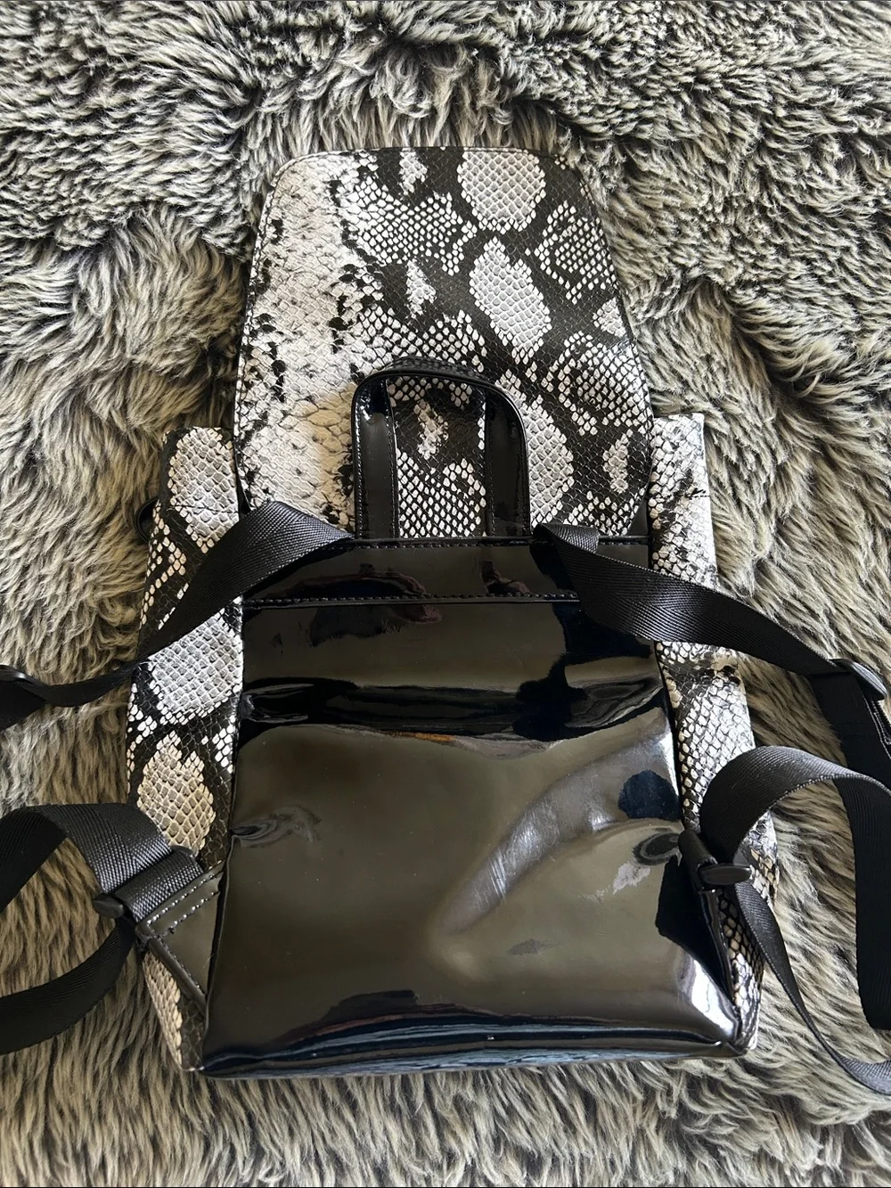 Small faux, snake skin and patent leather backpack